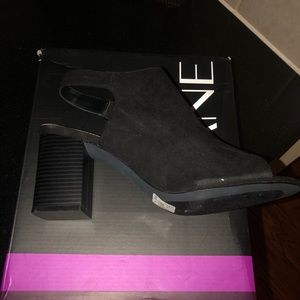 Black suede peep toe sandal.